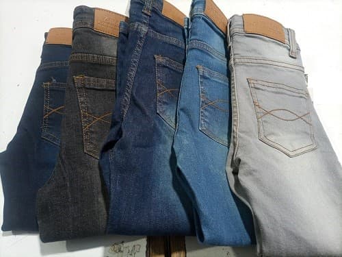 Jeans with branded leather patches