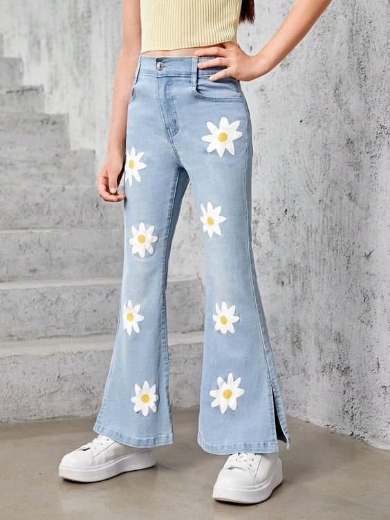 Women's daisy print flare jeans in light blue, front view