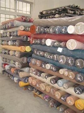 Fabric rolls sorted on shelves