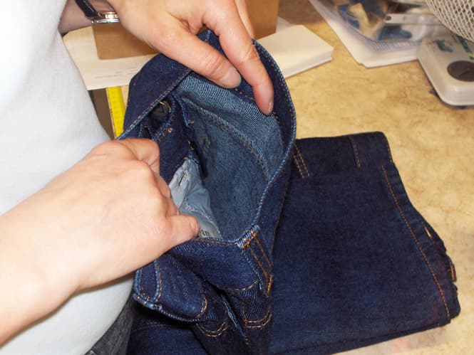 Inspecting a pair of jeans