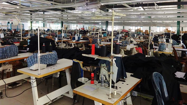 Sewing machines on a stitching line